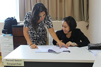 Reviewing data with a fellow researcher at Bangkok Hospital Phuket